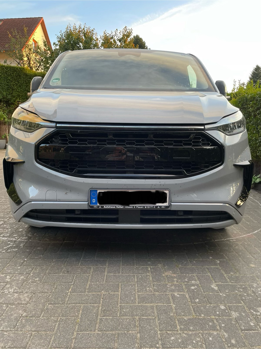 Transit Custom MK3 front canards installed — glossy black 2024+